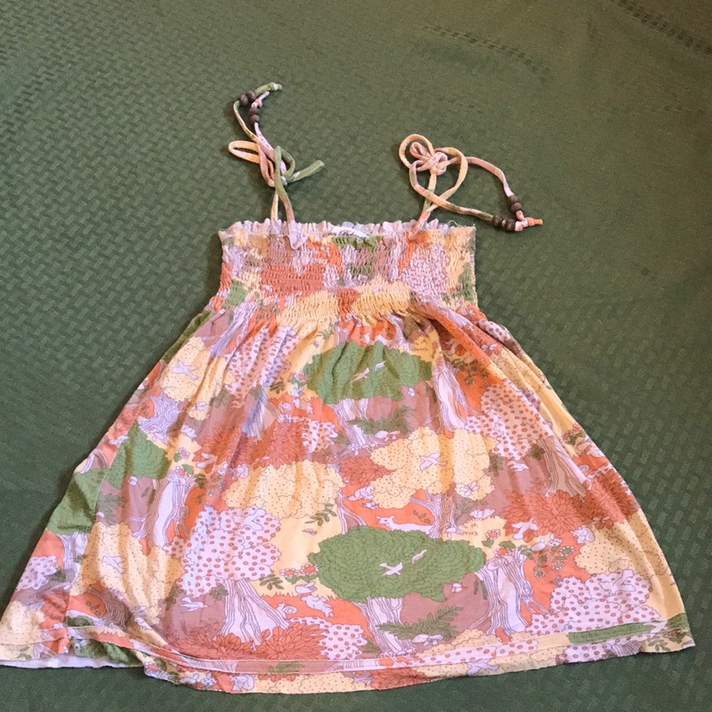 Urban behavior woodland tank top with adjustable beaded straps.